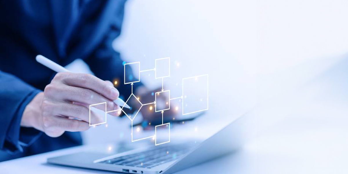 A person using a digital flowchart on a laptop, showcasing AI-powered process automation and technological innovation.